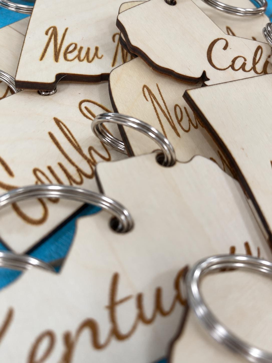 Wooden state shaped keychain on a metal key ring